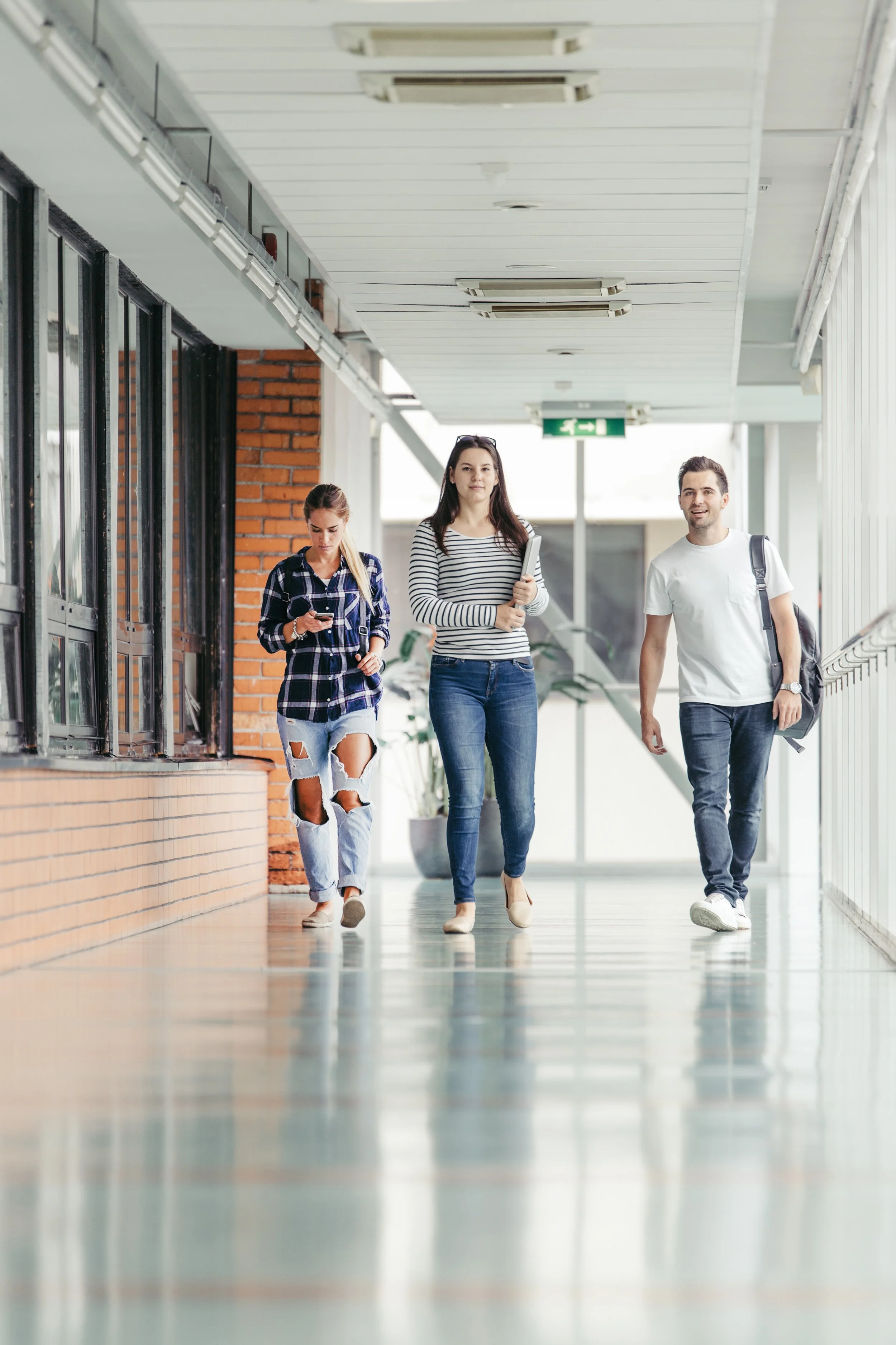 Students walking together through a school hall